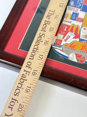 LOT 110: Framed Limited Edition Coca-Colay Sydney 2000 Olympics Bottle Puzzle Pin Set