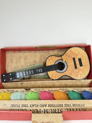LOT 118: Vintage Flutophone, Mattel Strum-Fun Getar, LL Bean Log Cabin Building Set & More