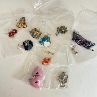 LOT 133: Eleven Pairs of Pierced Earrings