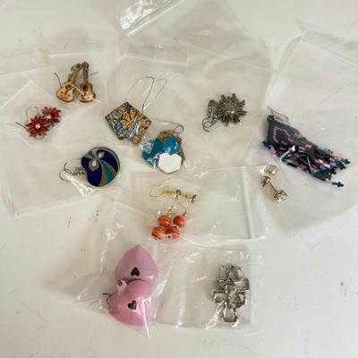 LOT 133: Eleven Pairs of Pierced Earrings