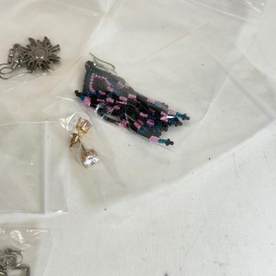 LOT 133: Eleven Pairs of Pierced Earrings