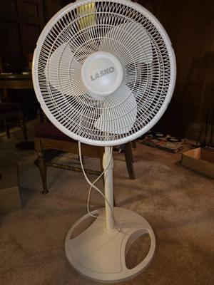 White Lasko standing fan