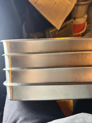 Metal trays-one with small holes