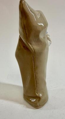 Sale Photo Thumbnail #605: Lladro "Boy with Snails" porcelain figurine, model number 4896. Approx. 9" tall.Release in 1974 and retired in 1979.