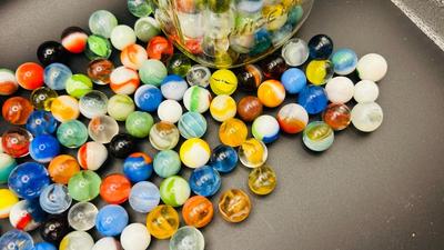 UNOPENED PACKAGE OF 100 MARBLES AND A JAR OF MISC MARBLES
