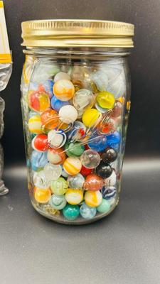 UNOPENED PACKAGE OF 100 MARBLES AND A JAR OF MISC MARBLES