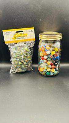 UNOPENED PACKAGE OF 100 MARBLES AND A JAR OF MISC MARBLES