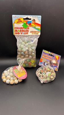 3 PACKAGES OF UNOPENED MARBLES