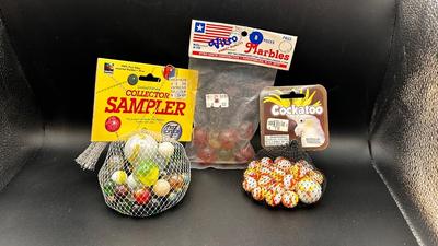 3 UNOPENED PACKAGES OF MARBLES