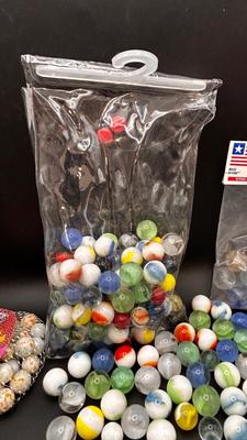 2 UNOPENED BAGS OF MARBLES AND SOME MISC