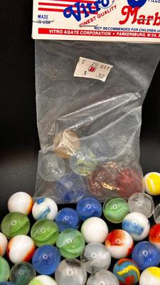 2 UNOPENED BAGS OF MARBLES AND SOME MISC
