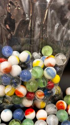 2 UNOPENED BAGS OF MARBLES AND SOME MISC