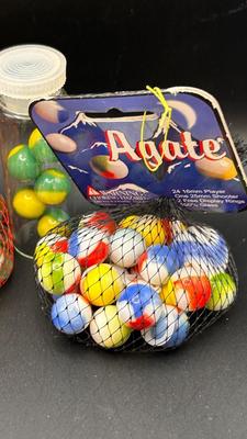 3 UNOPENED BAGS OF MARBLES AND A FEW LIKE MARBLES