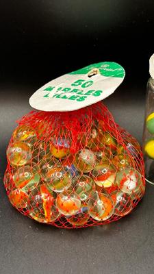 3 UNOPENED BAGS OF MARBLES AND A FEW LIKE MARBLES