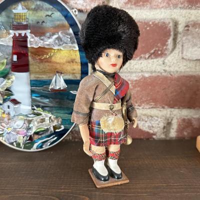 LOT 91F: Trinket collection: British Guard, Lighthouse Stained Glass, Dad's Shoes & More