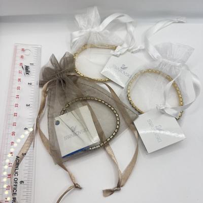LOT 136J: Three Swarovski Bracelets w/ Tags
