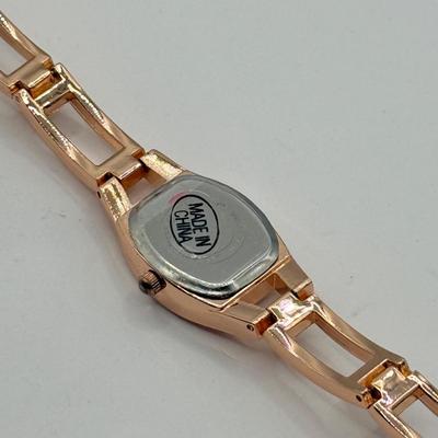 LOT 138J: Rose Gold Jewelry Collection: Apple Watch Band, Henri Bendel Bangles, Studio Time Quartz Cuff Watch, Geneva Watch & More