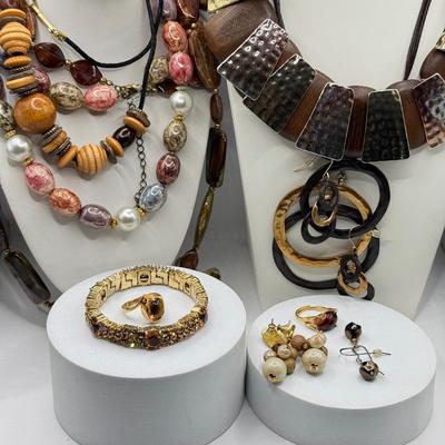LOT 147J: Earth Tone Jewelry: Statement Necklaces, Earrings & Crystal Bracelet