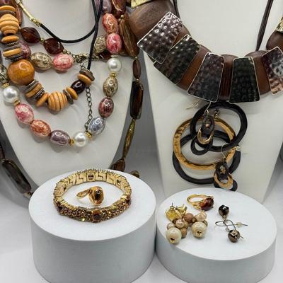LOT 147J: Earth Tone Jewelry: Statement Necklaces, Earrings & Crystal Bracelet