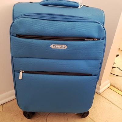 LOT 201L: Rolling Carry On Luggage by London Fog & Journey