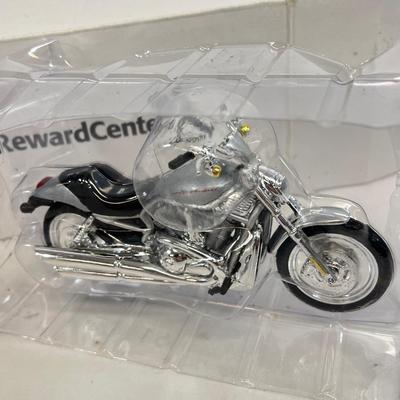 LOT 66: Harley Davidson Items - Storage Bag, History Book, Model Motorcycles