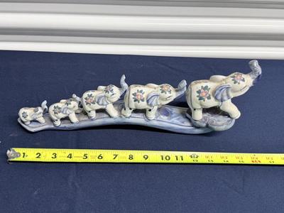 Elephant parade on bridge