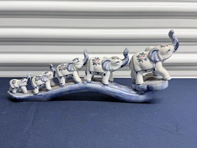 Elephant parade on bridge