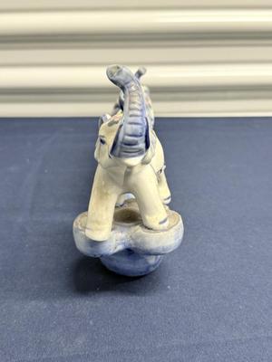 Elephant parade on bridge