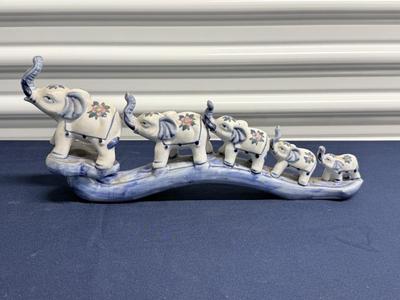 Elephant parade on bridge