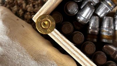 LARGE LOT OF 45 SHELLS AND BULLETS FOR RELOADING