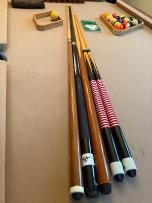 Pool table with sticks & balls
