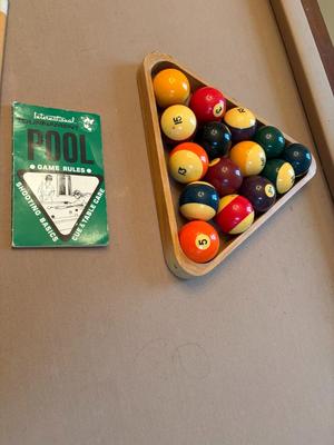 Pool table with sticks & balls