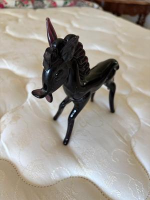 2 purple glass horses