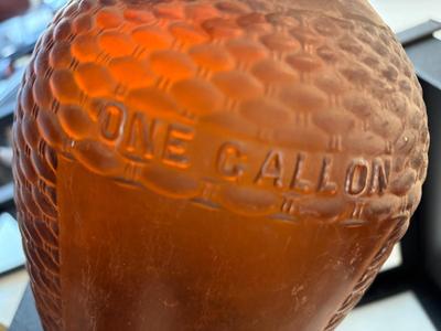 Brown one gallon glass jug