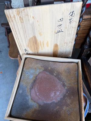 Heavy stone plate in wooden case