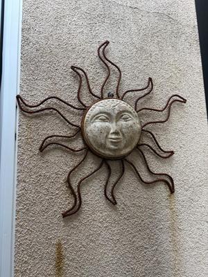 Sun face wall decoration