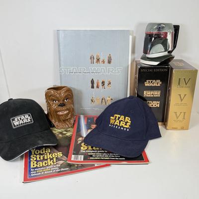 LOT 64: Star Wars Special Edition Original Trilogy on VHS & DVD, Disney World Star Wars Weekends Hats, Boba Fett & Chewie Mugs