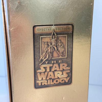 LOT 64: Star Wars Special Edition Original Trilogy on VHS & DVD, Disney World Star Wars Weekends Hats, Boba Fett & Chewie Mugs