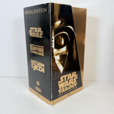 LOT 64: Star Wars Special Edition Original Trilogy on VHS & DVD, Disney World Star Wars Weekends Hats, Boba Fett & Chewie Mugs