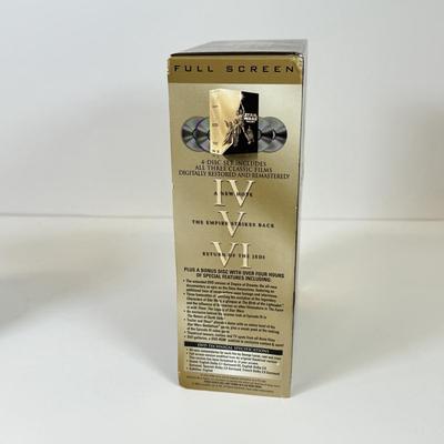 LOT 64: Star Wars Special Edition Original Trilogy on VHS & DVD, Disney World Star Wars Weekends Hats, Boba Fett & Chewie Mugs