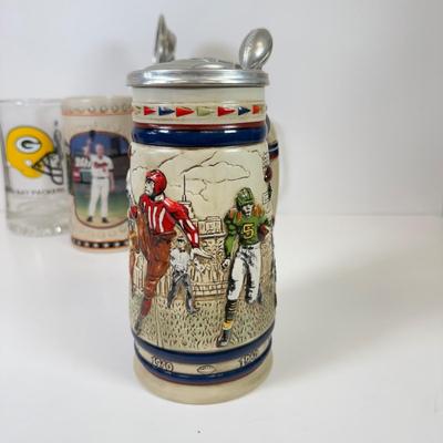 LOT 65: Sports Memorabilia Collection: Slim Jim Glass Mugs, Avon Stein, Riddell Mini Helmets & More