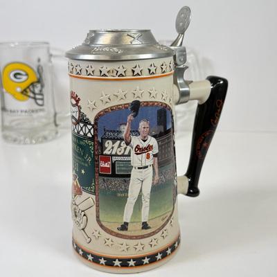LOT 65: Sports Memorabilia Collection: Slim Jim Glass Mugs, Avon Stein, Riddell Mini Helmets & More