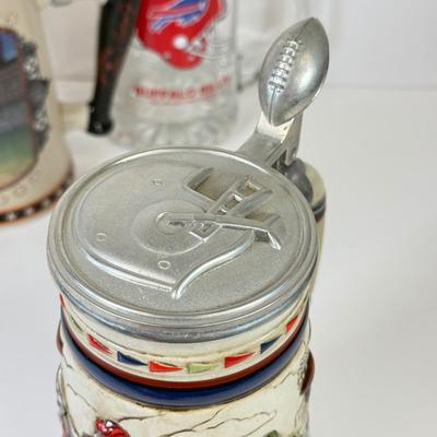 LOT 65: Sports Memorabilia Collection: Slim Jim Glass Mugs, Avon Stein, Riddell Mini Helmets & More