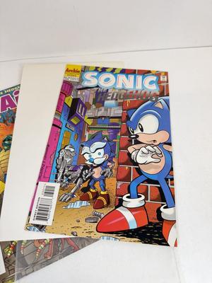 LOT 78: Collection of Vintage Comics: Disney's Uncle Scrooge, Sonic & Tails, Street Sharks, TMNT & More