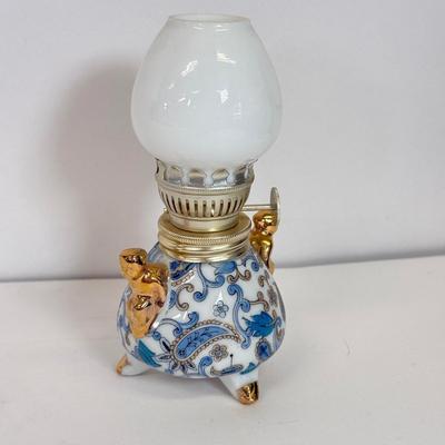 LOT 104: Antique Daguerreotype Photo, Lefton China Mini Lamp & Curved Glass Hawaiian Flora 24kt Gold Wall Decor