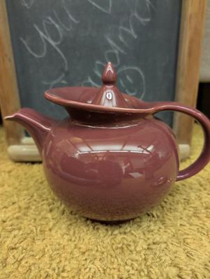 Misc items including old tin cans, chalkboard, teapot