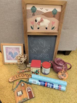 Misc items including old tin cans, chalkboard, teapot