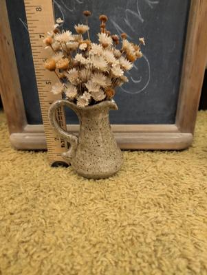 Misc items including old tin cans, chalkboard, teapot