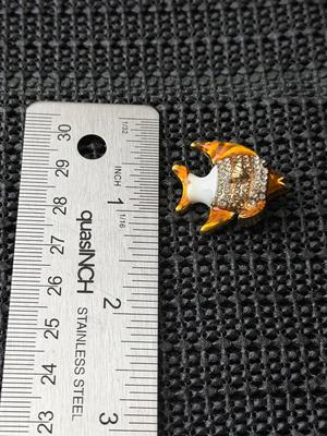 gold-toned and enamel fish brooch pin with rhinestone accents.