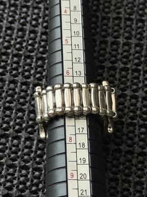 Silver tone adjustable ring with turquoise and brown triangles design